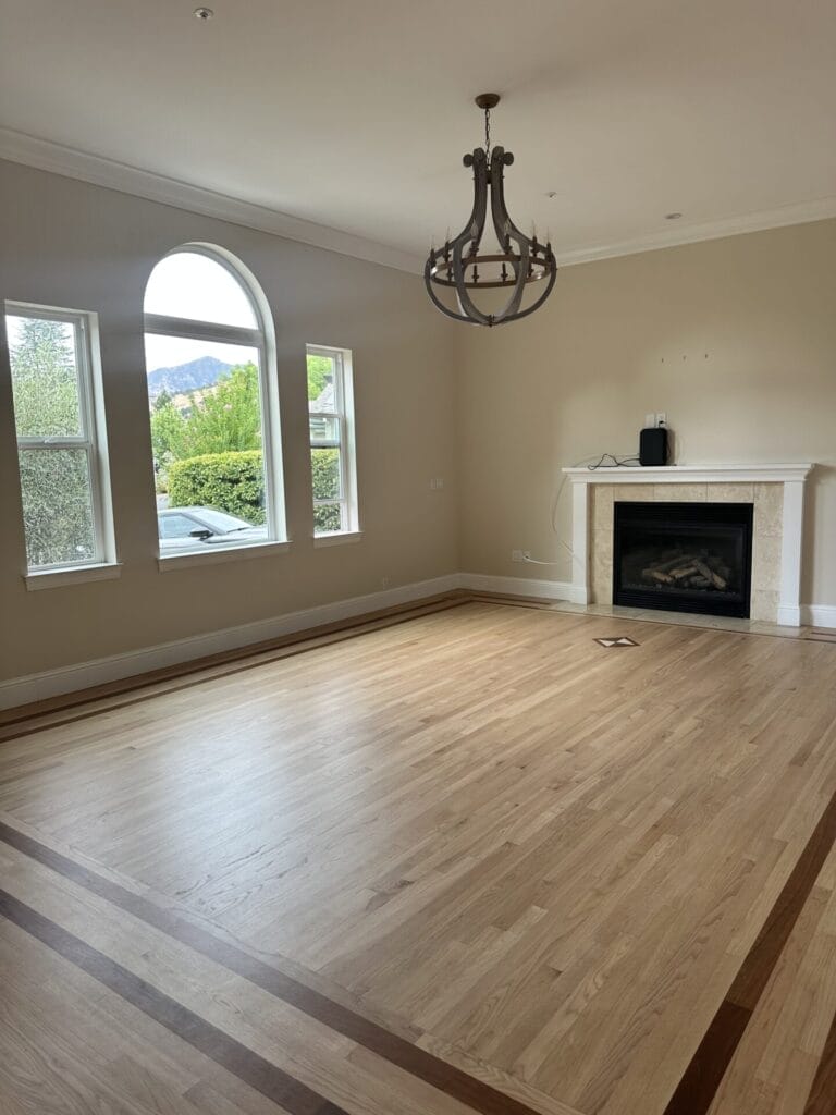 Before photo of a living room with outdated furniture and neutral decor.
